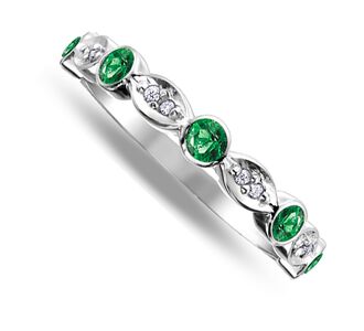 Nine carat white gold emerald and diamond band ring